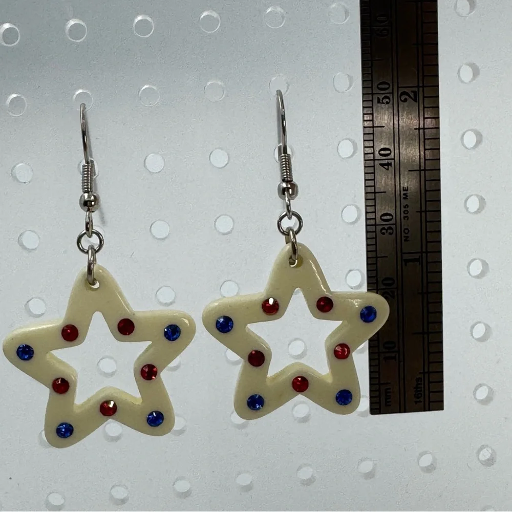 White Plastic Star Earrings With Red and Blue Rhinestones